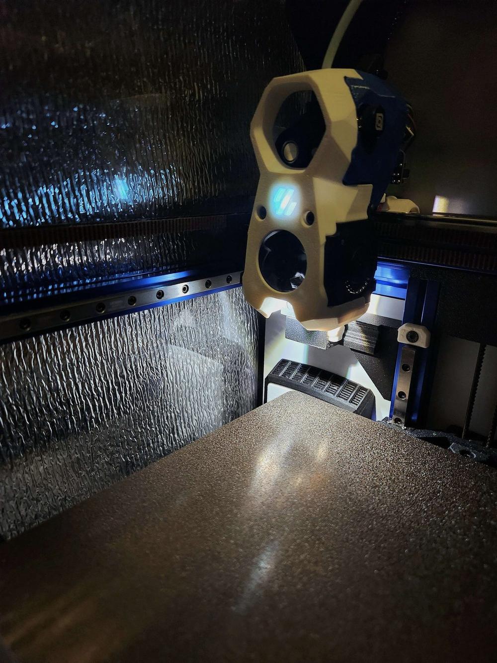 Toolhead inside the lined chamber, foil insulation visible